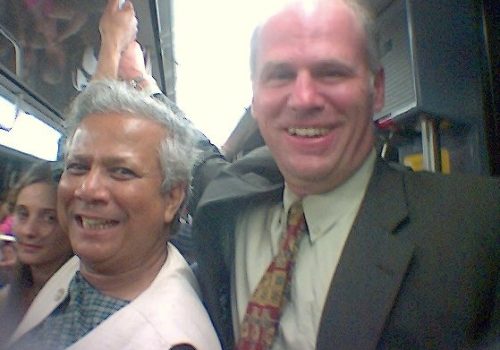Nobel Peace Prize Laureate, Mohammed Yunus, and Gregory F Casagrande share laughs together while riding the Metro in Paris, France.